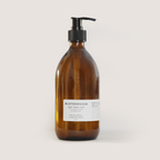 Amber bottle of SONNENHAIN Bio-Handseife with pump dispenser, made from organic coconut and sunflower oils, fragrance-free, gentle on skin and environment.
