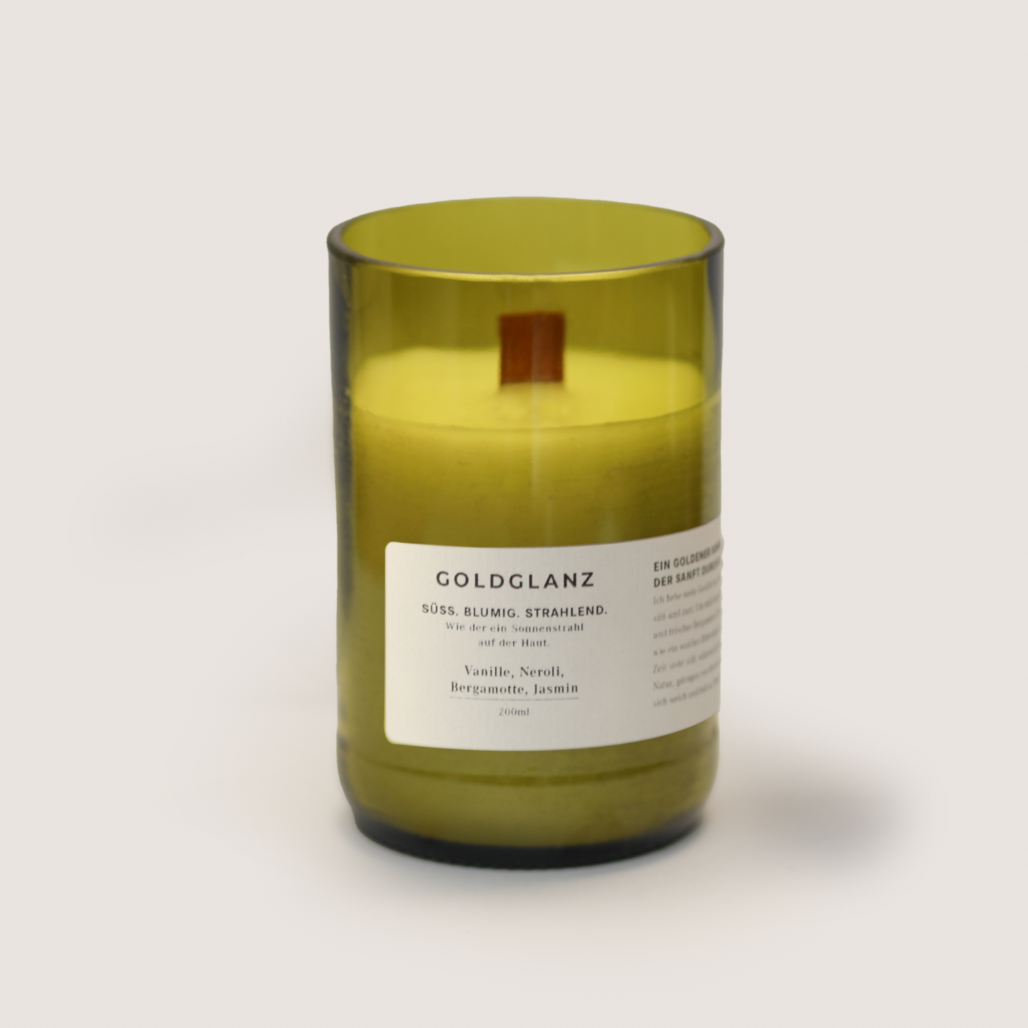 GOLDGLANZ 200ml scented candle with vanilla, neroli, bergamot, and jasmine in a yellow glass container