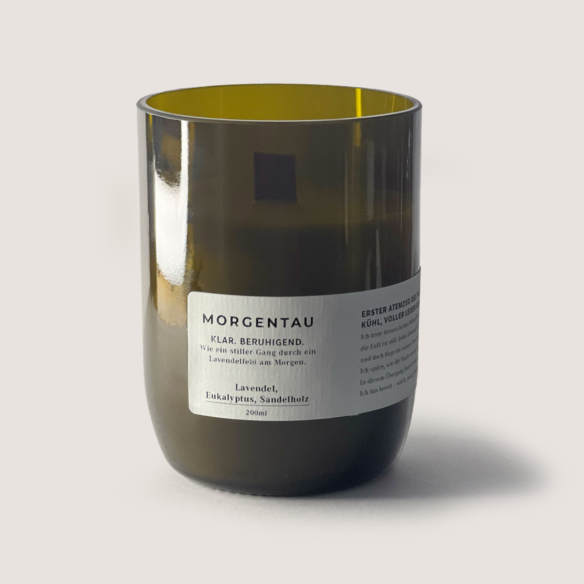 SONNENHOLZ 350ml scented candle with lavender, eucalyptus, and sandalwood in a green glass jar