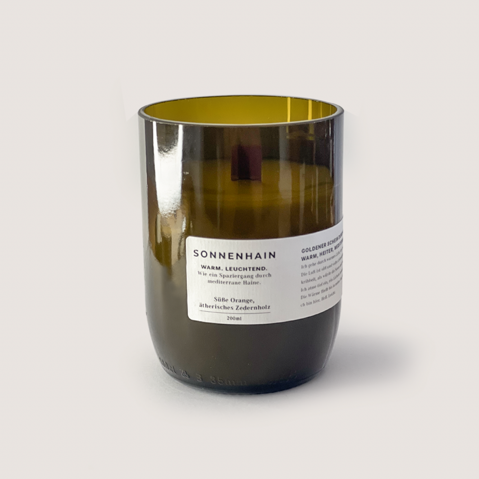 SONNENHAIN 250ml scented candle with sweet orange and cedarwood in a warm brown glass container